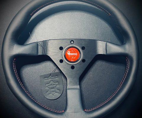 Momo Monte Carlo 350mm leather with red stitching